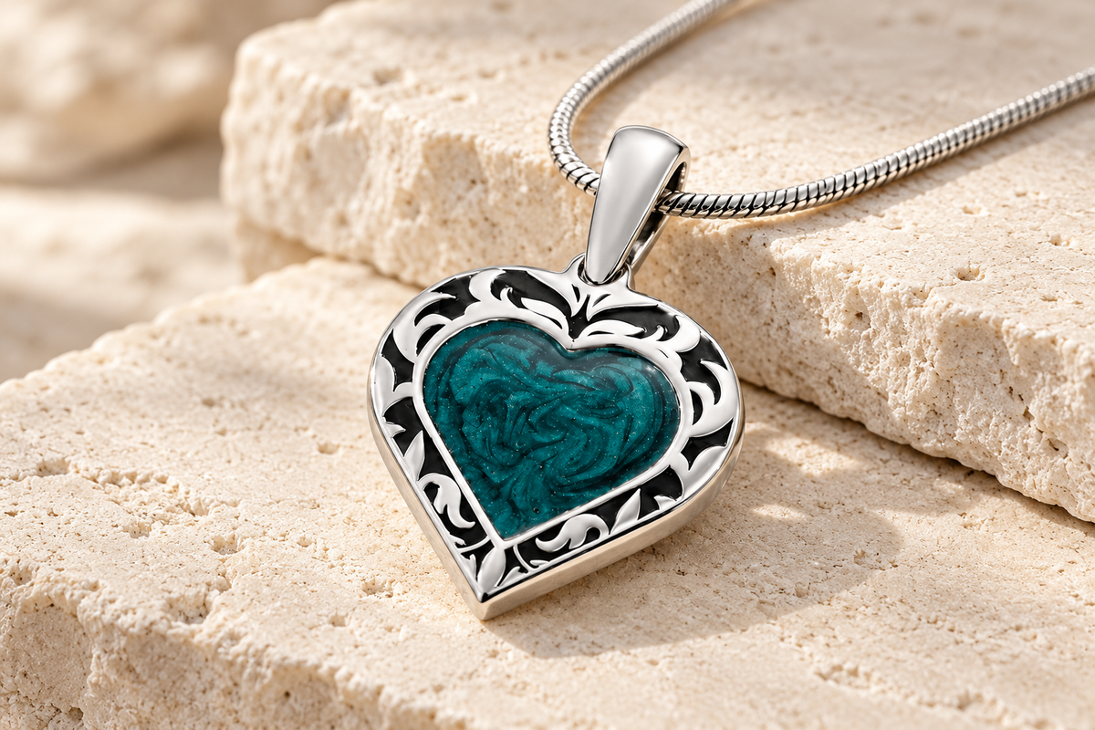 Silver Heartfelt Journey ash resin heart pendant on cream limestone