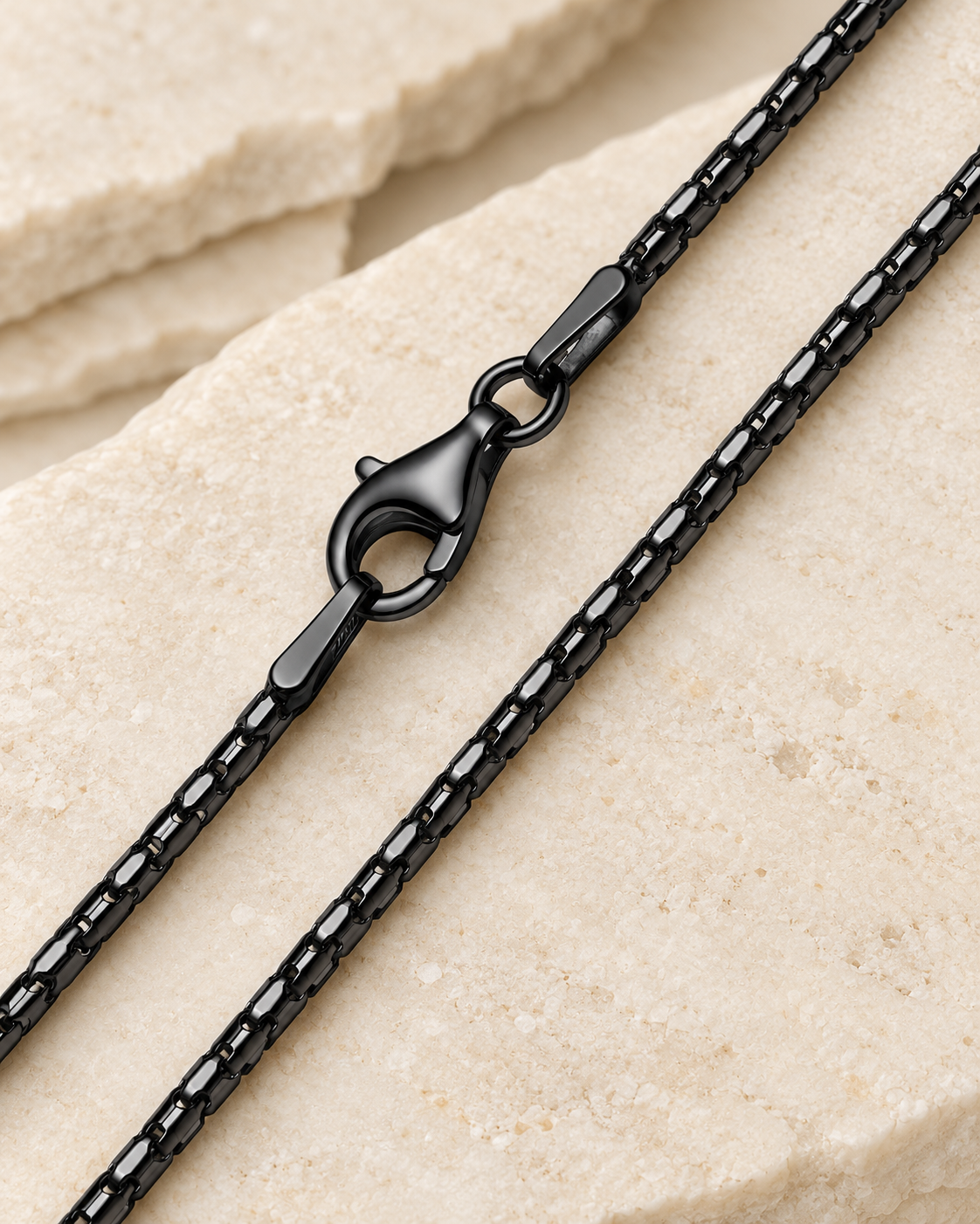 30 inch black premium coreana chain with lobster clasp on cream stone.