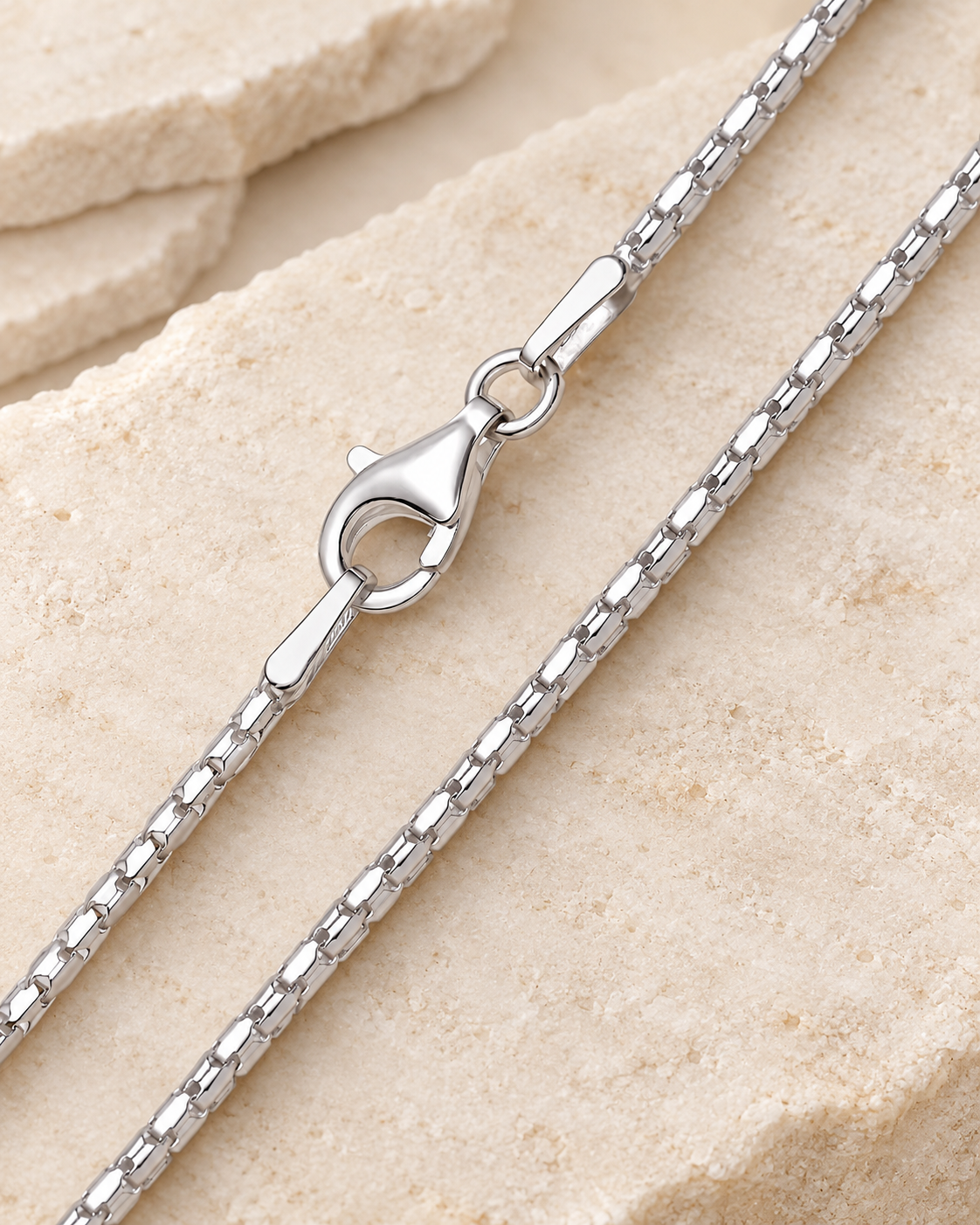 30 inch silver premium coreana chain with lobster clasp on cream stone.