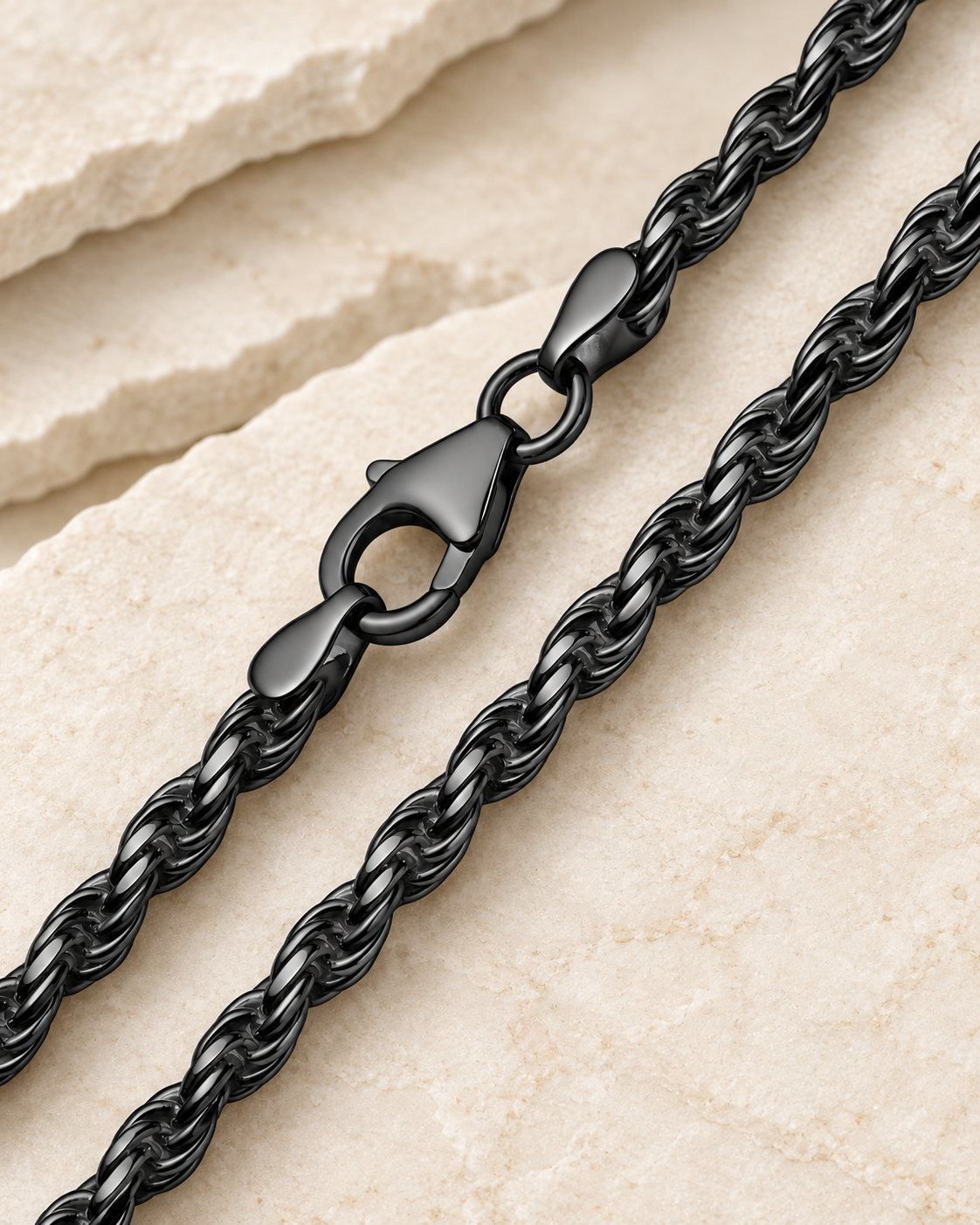 28 inch black premium men's rope chain with lobster clasp on cream stone.