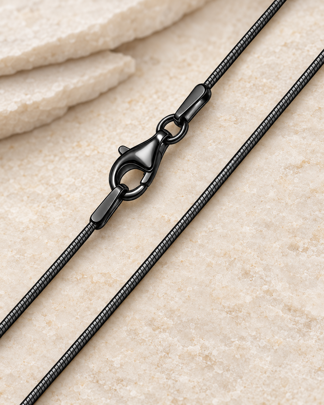 20 inch black stainless steel snake chain with lobster clasp.