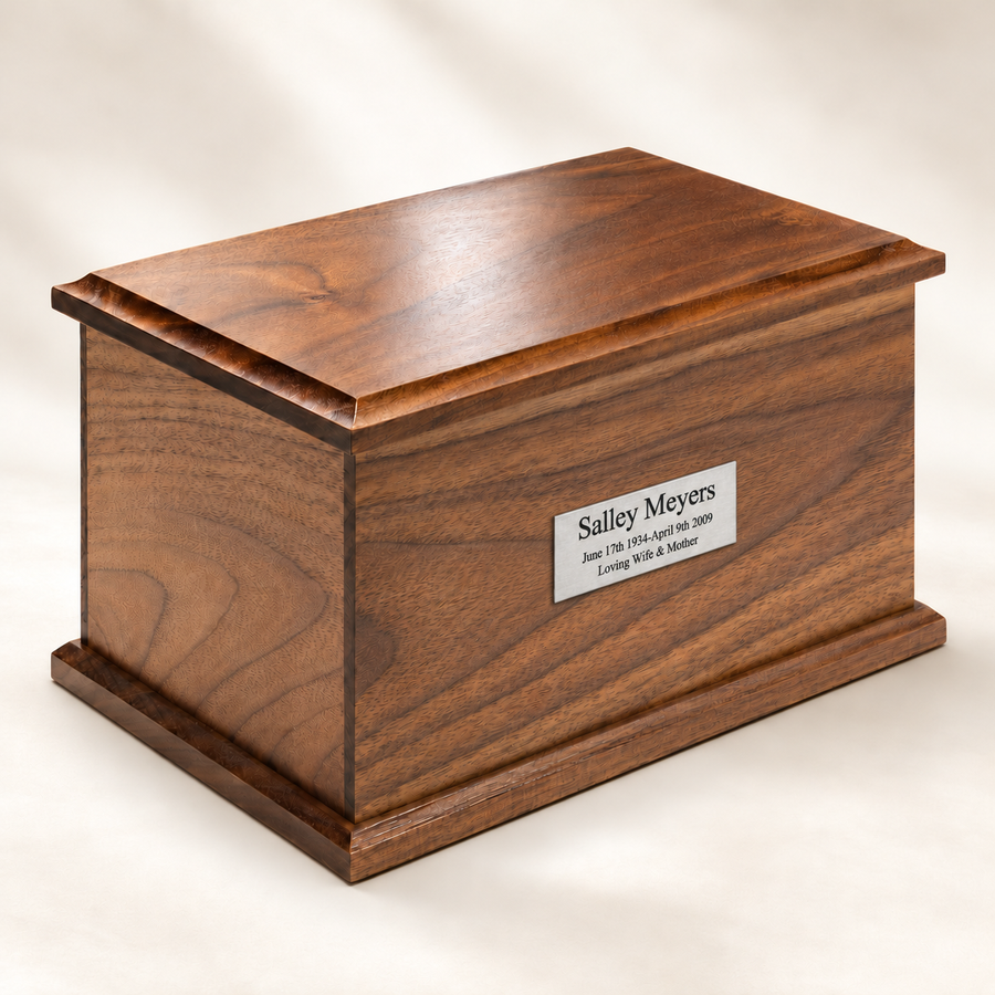 Walnut urn shown with optional 3 by 1 inch Small Carina silver engraved plate
