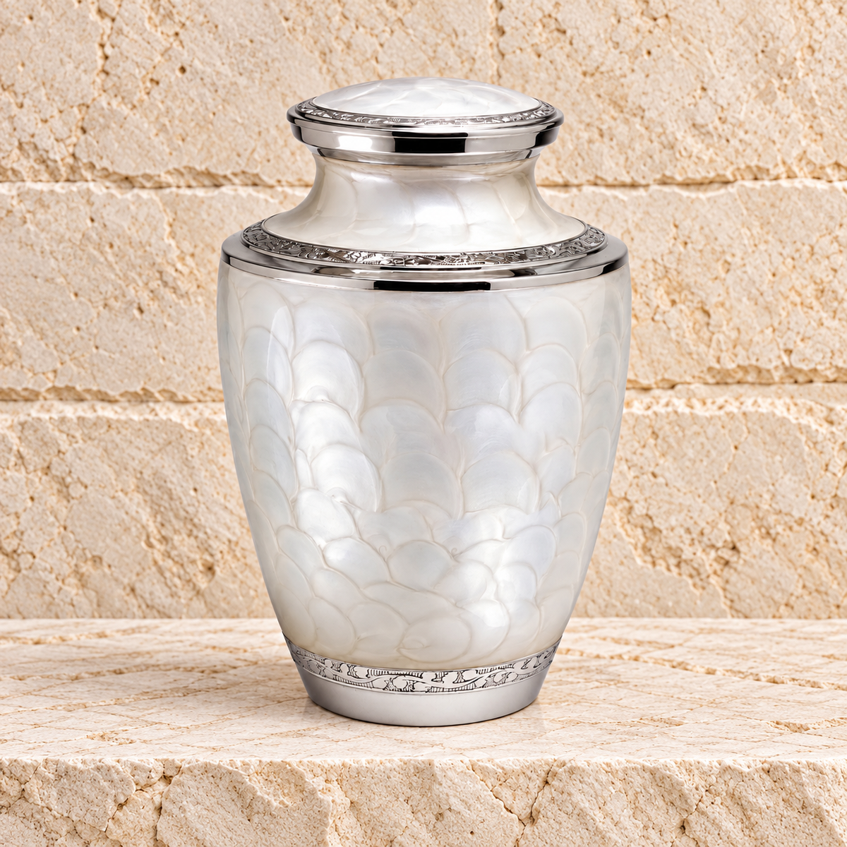 Pearl Beauty cremation urn on cream stacked stone