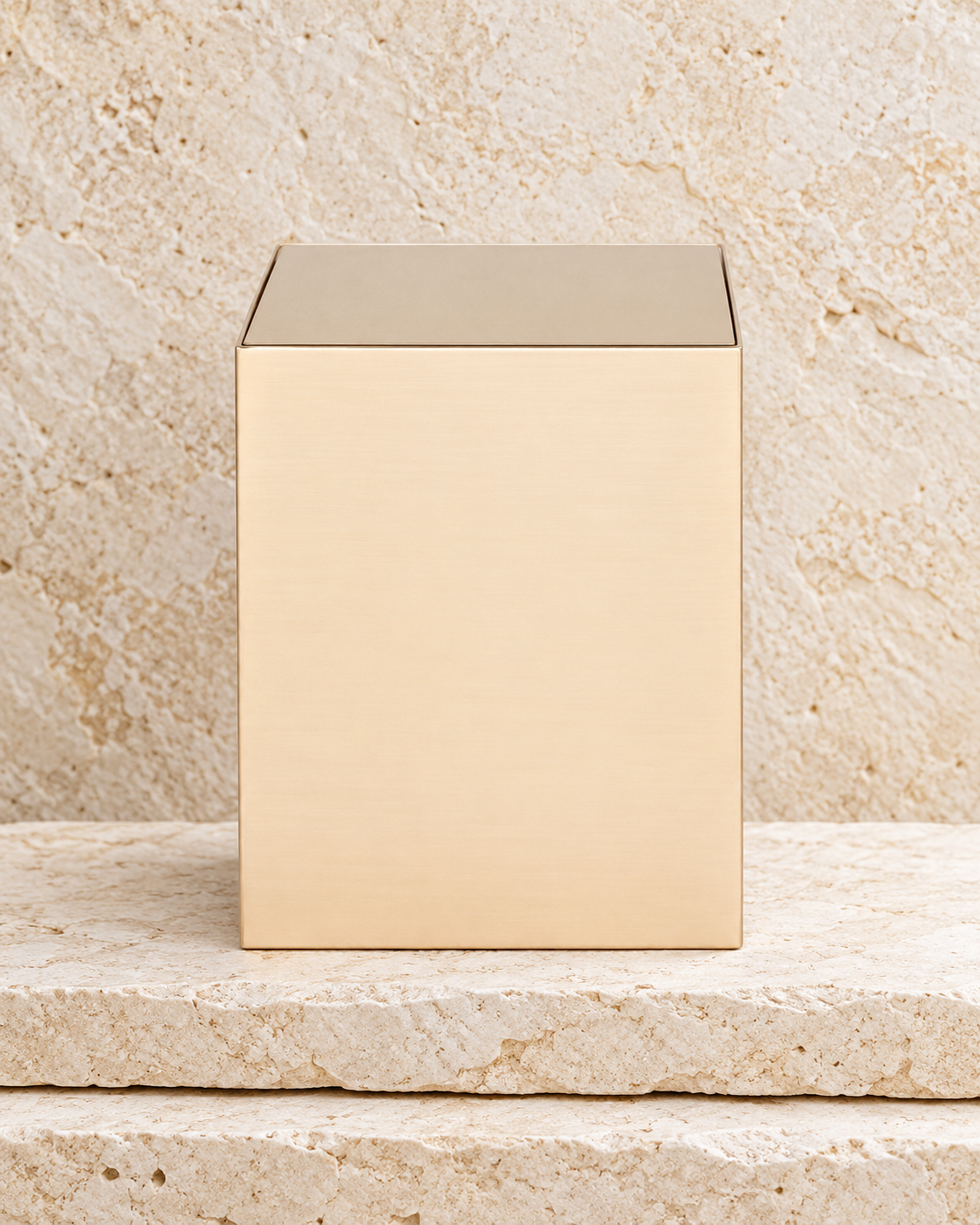 arrowstar bronze cremation urn on cream stacked stone, portrait product photograph
