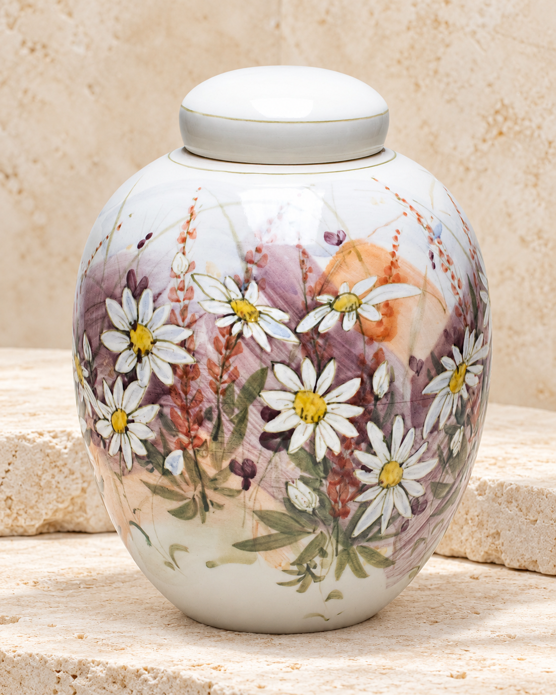 daisies ceramic cremation urn on cream stacked stone, portrait product photograph