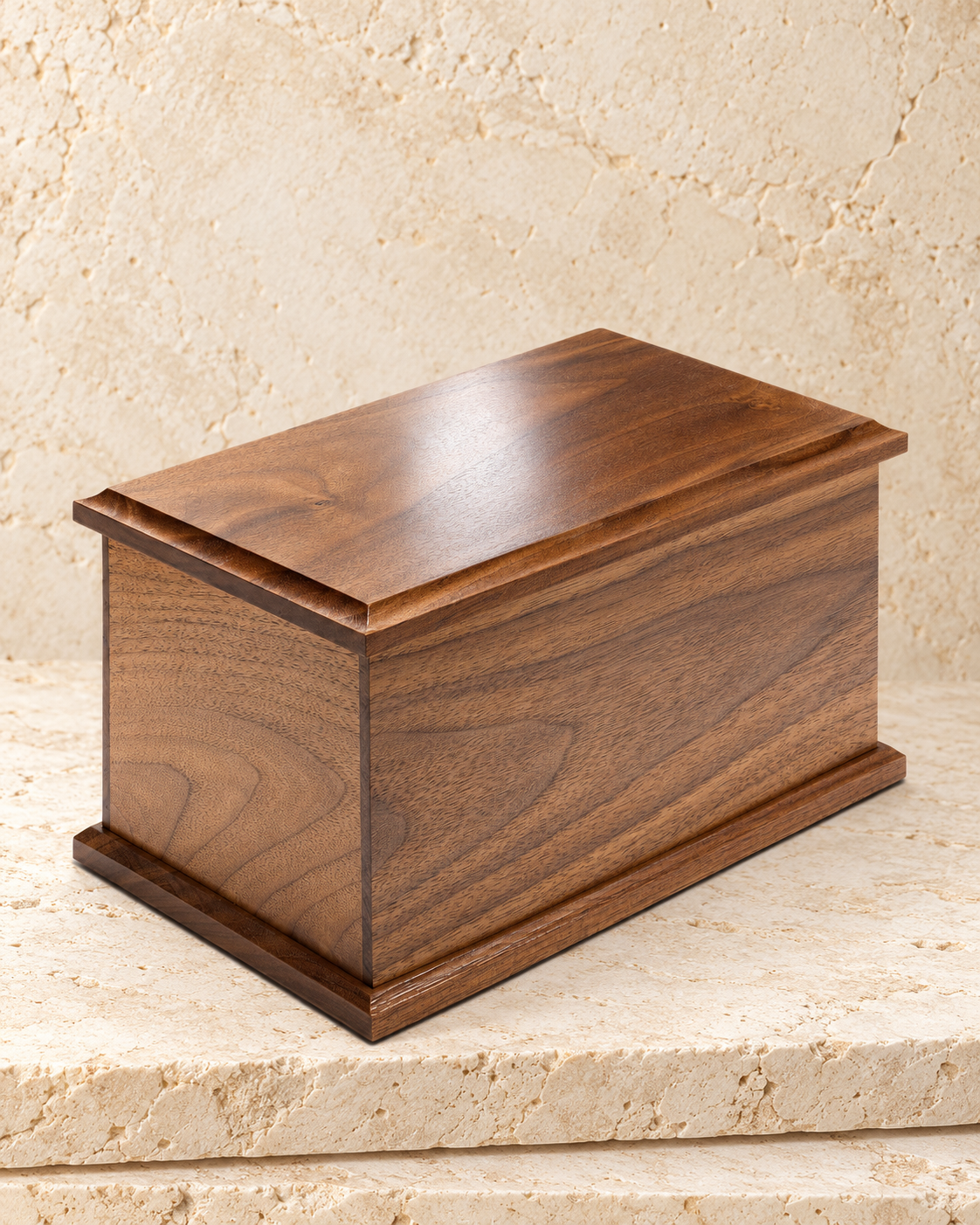 extra large walnut cremation urn on cream stacked stone, portrait product photograph