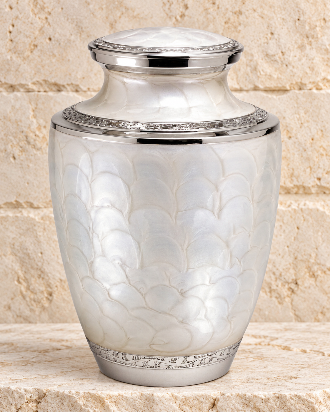 pearl beauty cremation urn on cream stacked stone, portrait product photograph