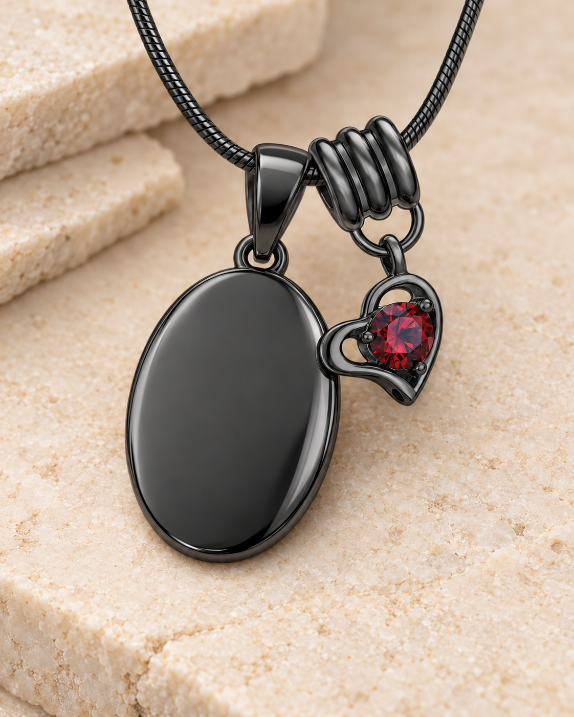 January black birthstone heart hanger with an illustrative matching oval pendant; display pendant and chain sold separately.