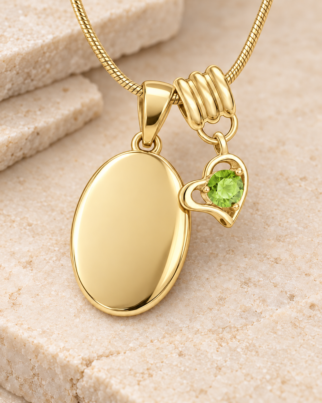 August gold birthstone heart hanger with an illustrative matching oval pendant; display pendant and chain sold separately.