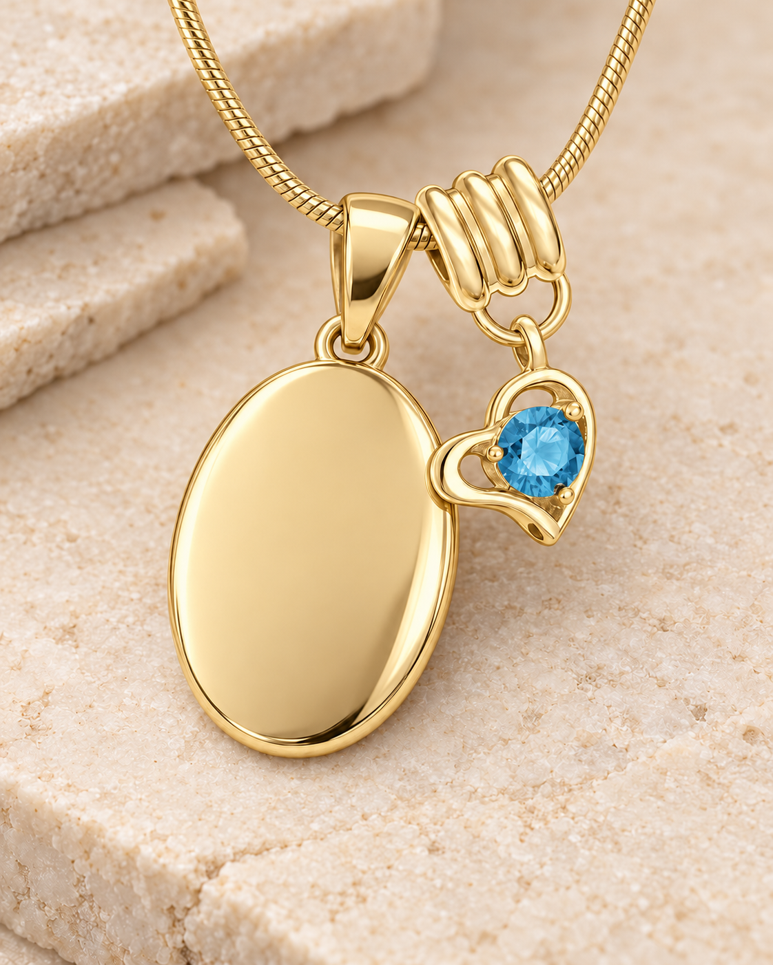 December gold birthstone heart hanger with an illustrative matching oval pendant; display pendant and chain sold separately.