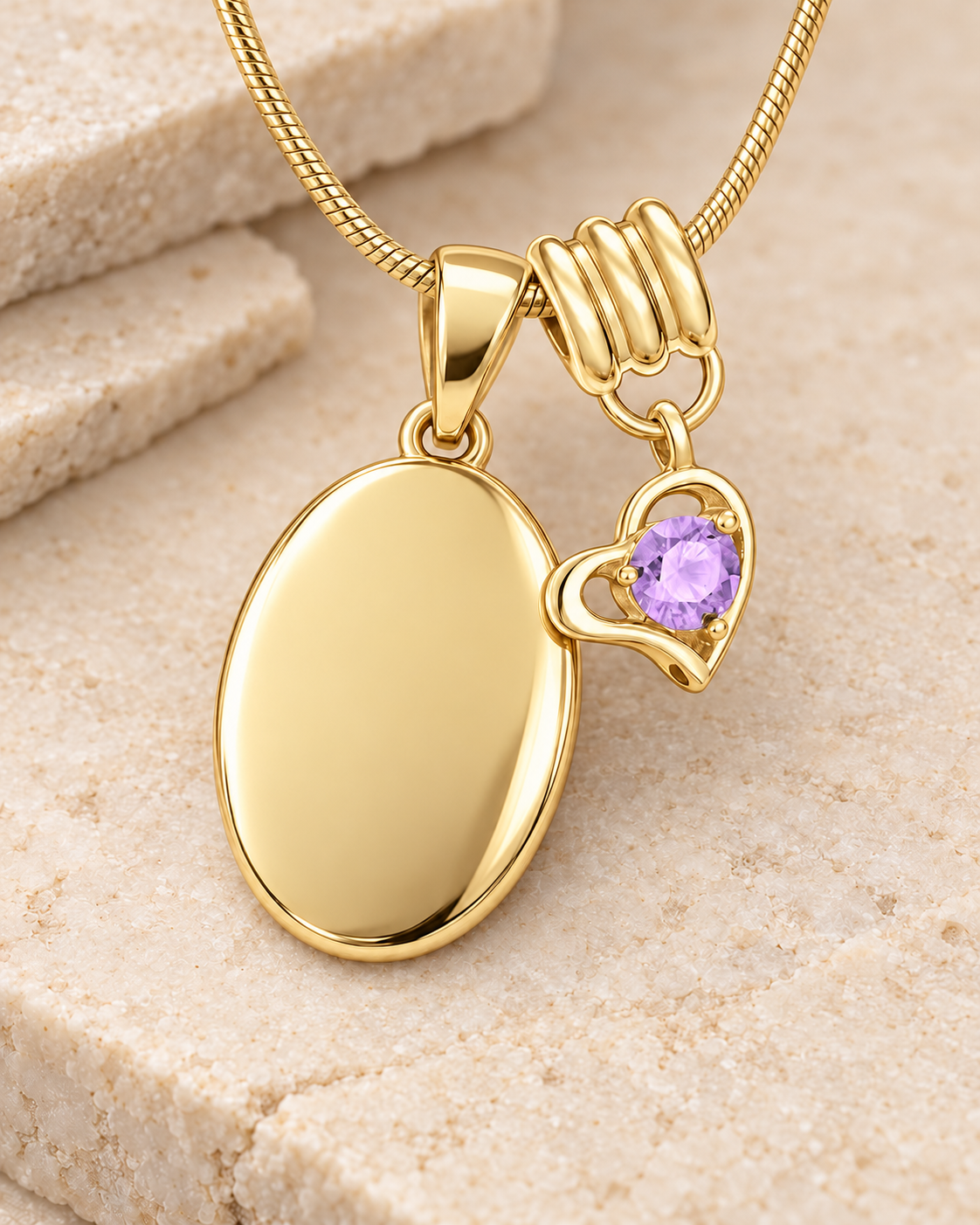 June gold birthstone heart hanger with an illustrative matching oval pendant; display pendant and chain sold separately.