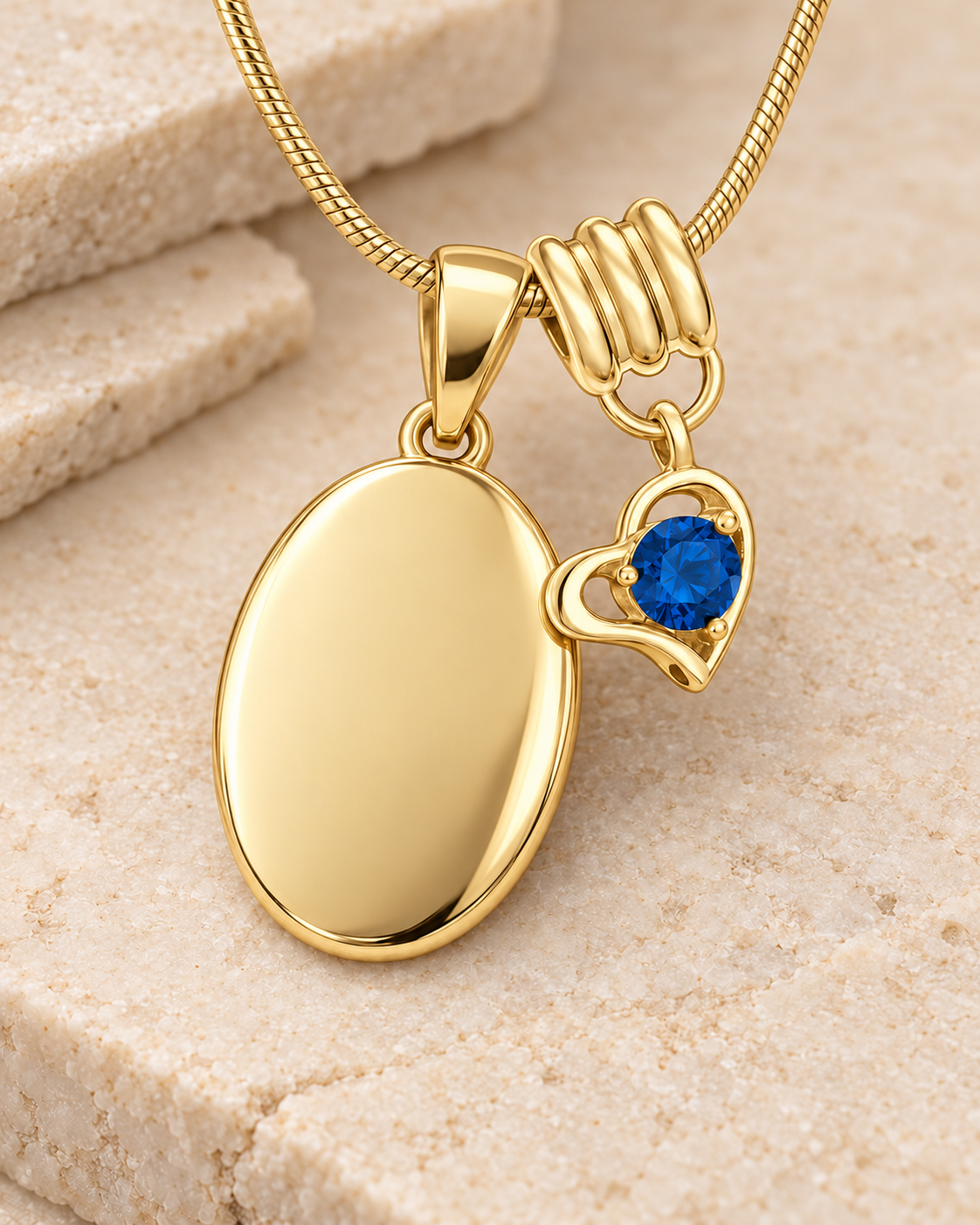 September gold birthstone heart hanger with an illustrative matching oval pendant; display pendant and chain sold separately.