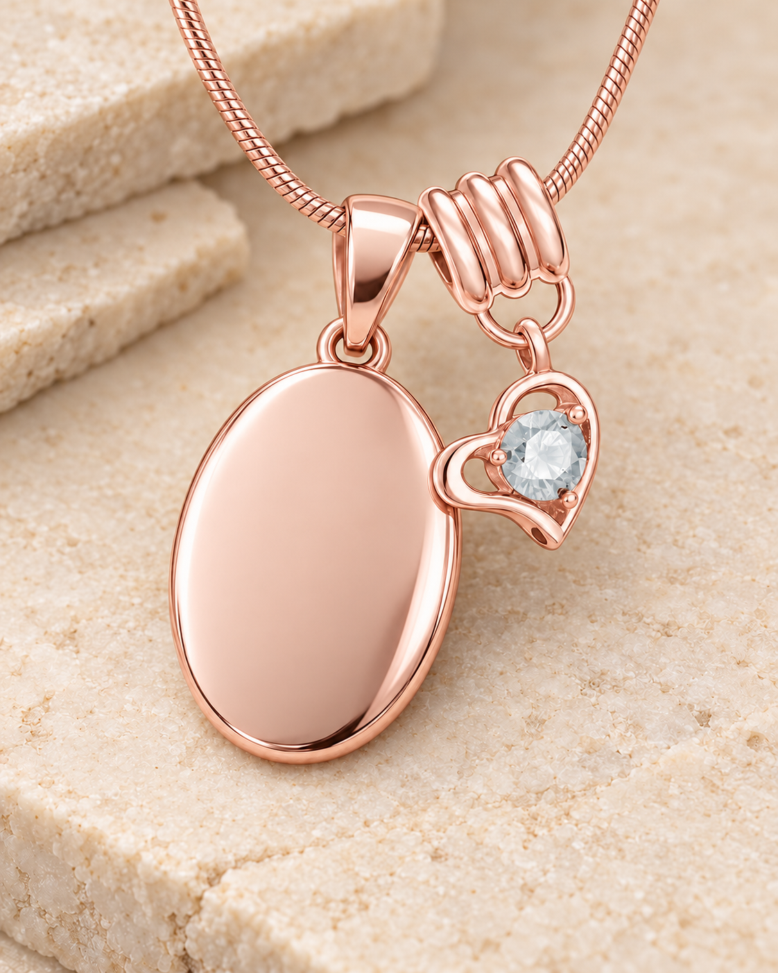 April rose gold birthstone heart hanger with an illustrative matching oval pendant; display pendant and chain sold separately.