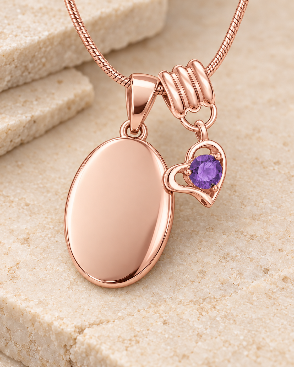 February rose gold birthstone heart hanger with an illustrative matching oval pendant; display pendant and chain sold separately.