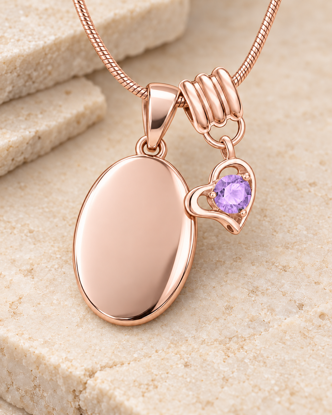 June rose gold birthstone heart hanger with an illustrative matching oval pendant; display pendant and chain sold separately.