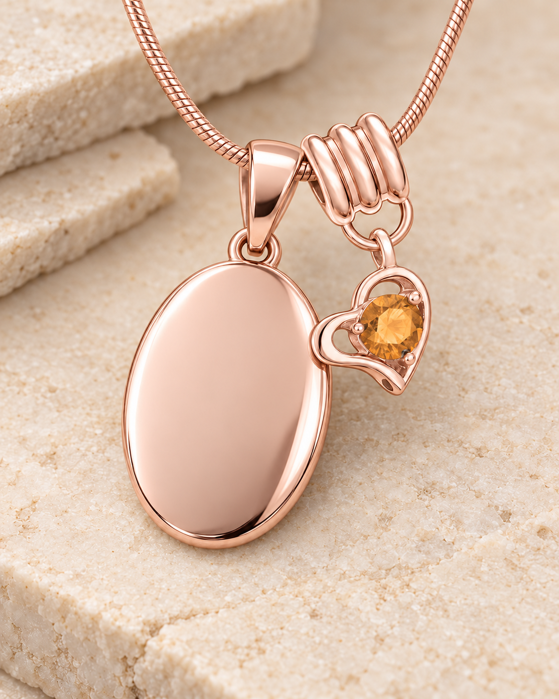 November rose gold birthstone heart hanger with an illustrative matching oval pendant; display pendant and chain sold separately.