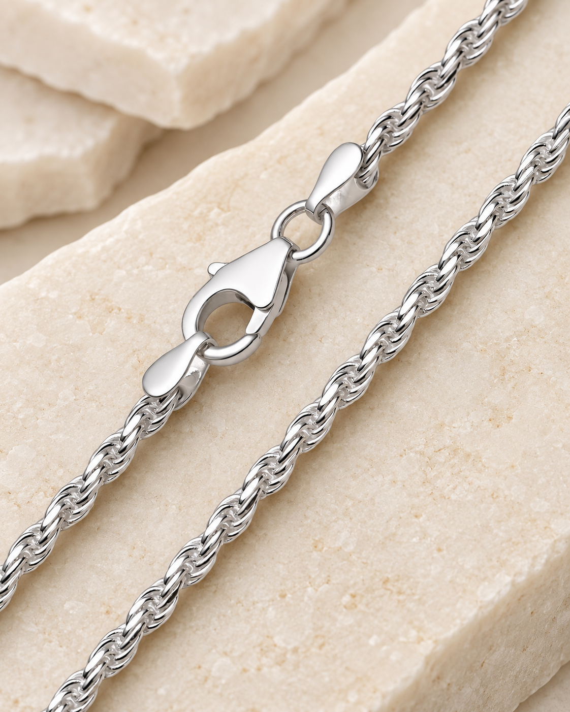 30 inch silver premium women's rope chain with lobster clasp on cream stone.