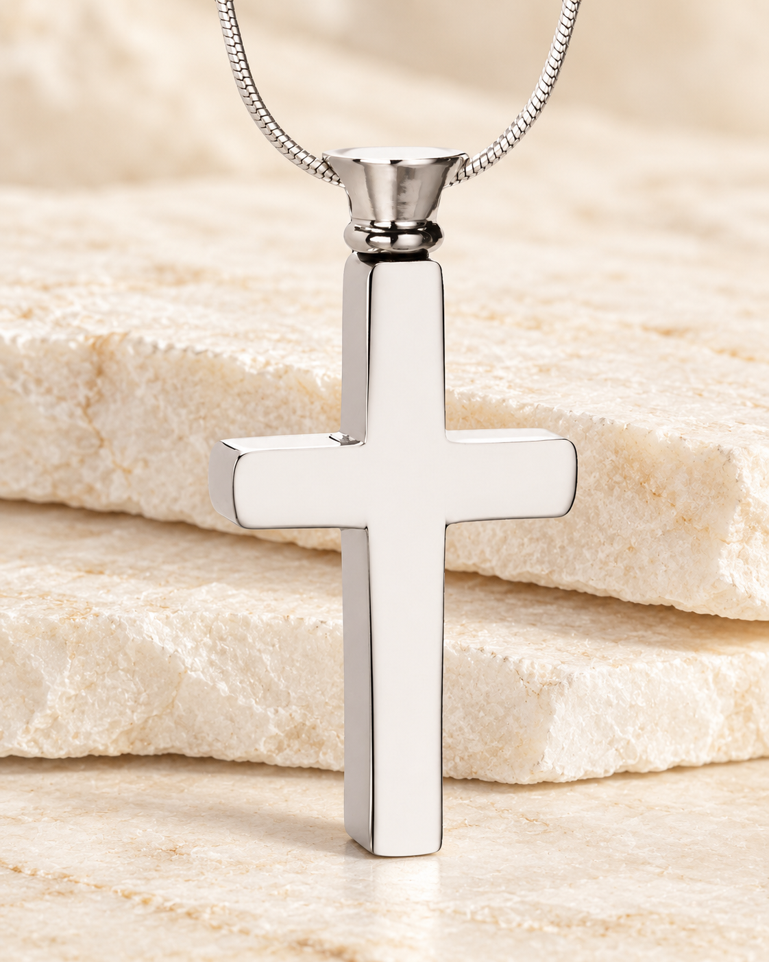 Forever Collection Silver Remembrance Cross Locket Necklace on a cream stacked-stone background