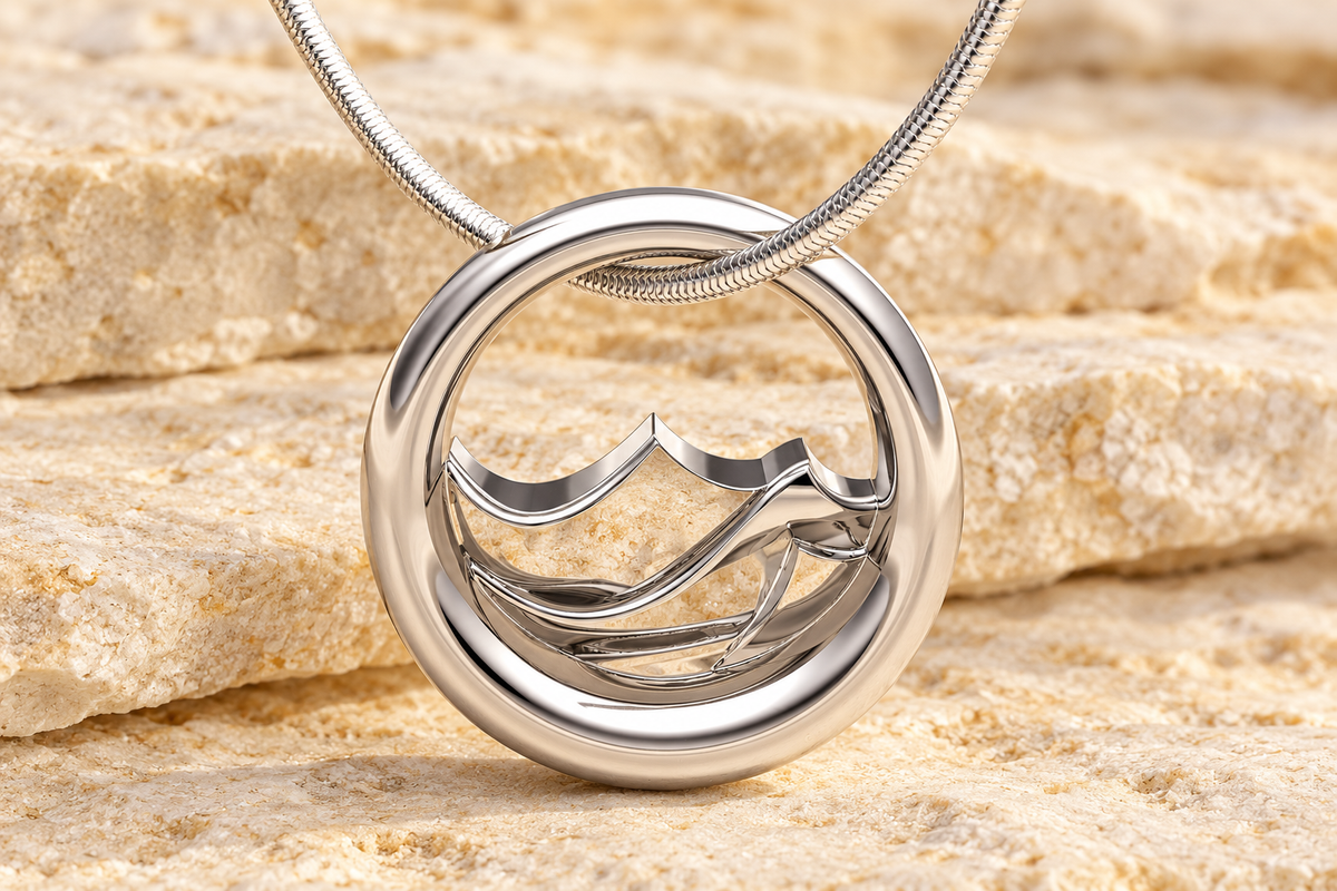 Silver Appalachia Forever Sealed mountain pendant on warm cream limestone