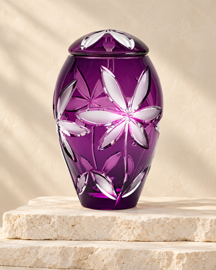 Purple Flowers cremation urn on stacked cream stone.