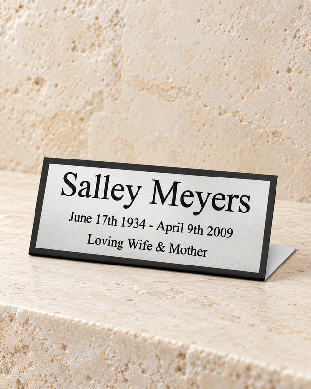 draco easel engraved plate on cream stacked stone, portrait product photograph
