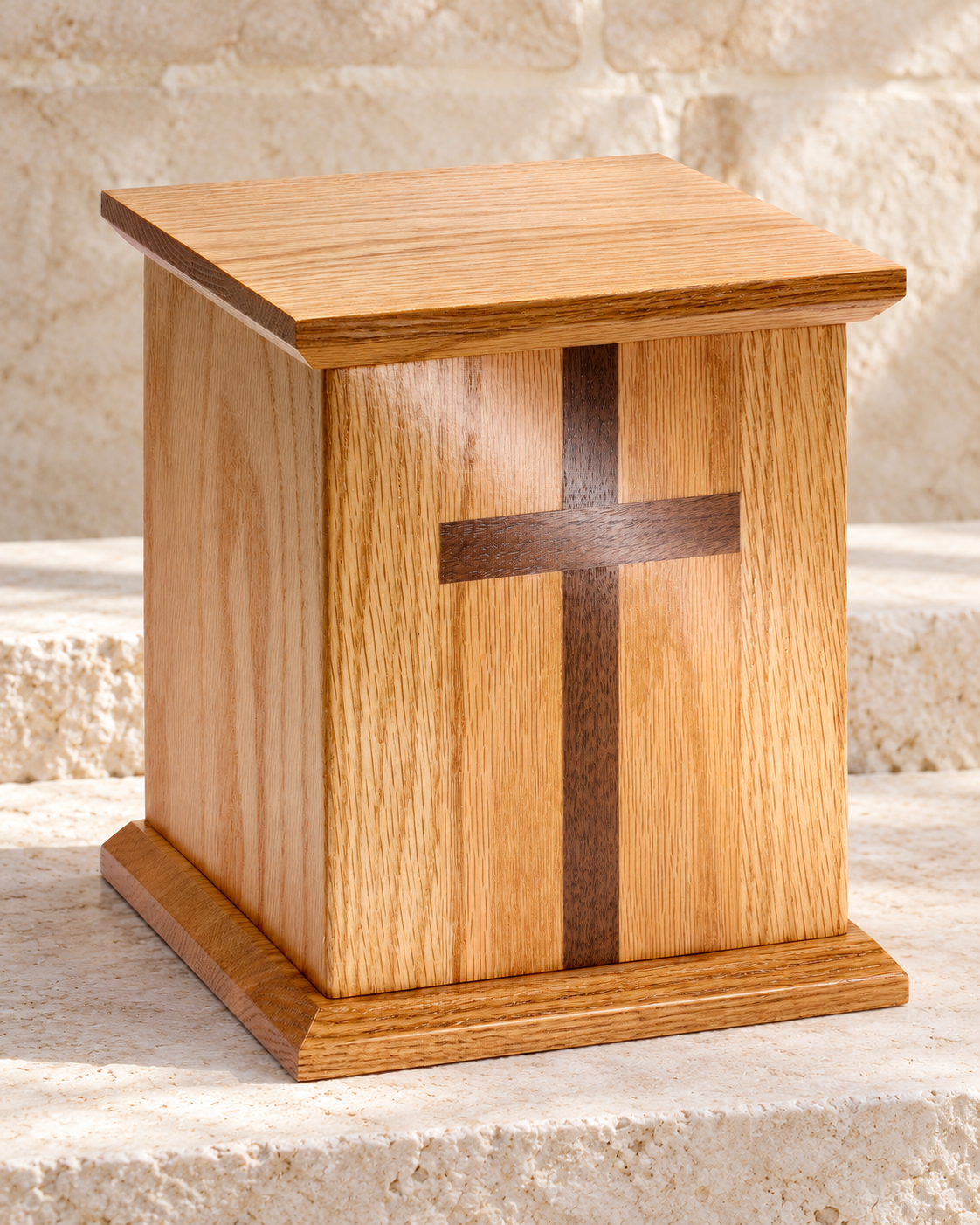 square oak cremation urn w walnut cross on cream stacked stone, portrait product photograph