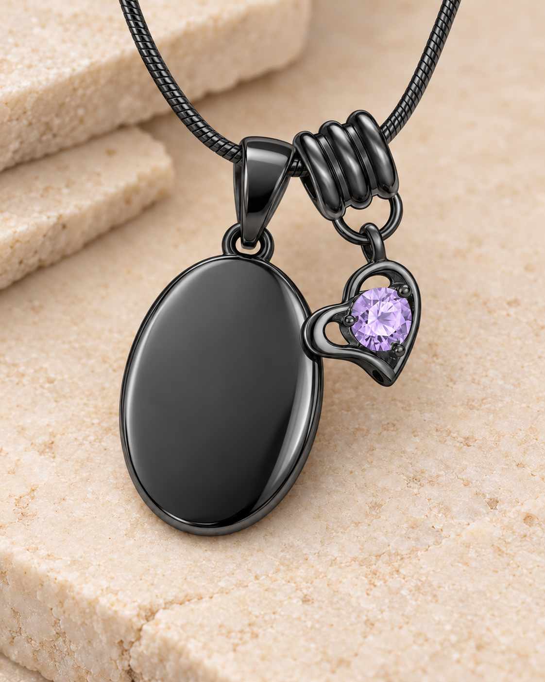 June black birthstone heart hanger with an illustrative matching oval pendant; display pendant and chain sold separately.