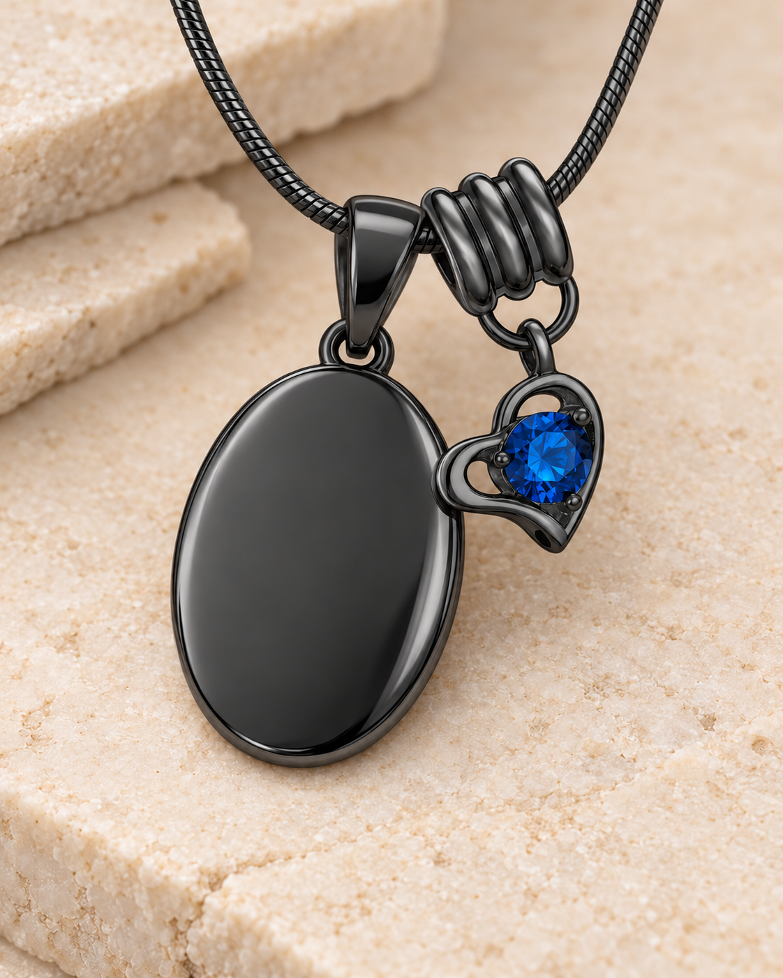 September black birthstone heart hanger with an illustrative matching oval pendant; display pendant and chain sold separately.