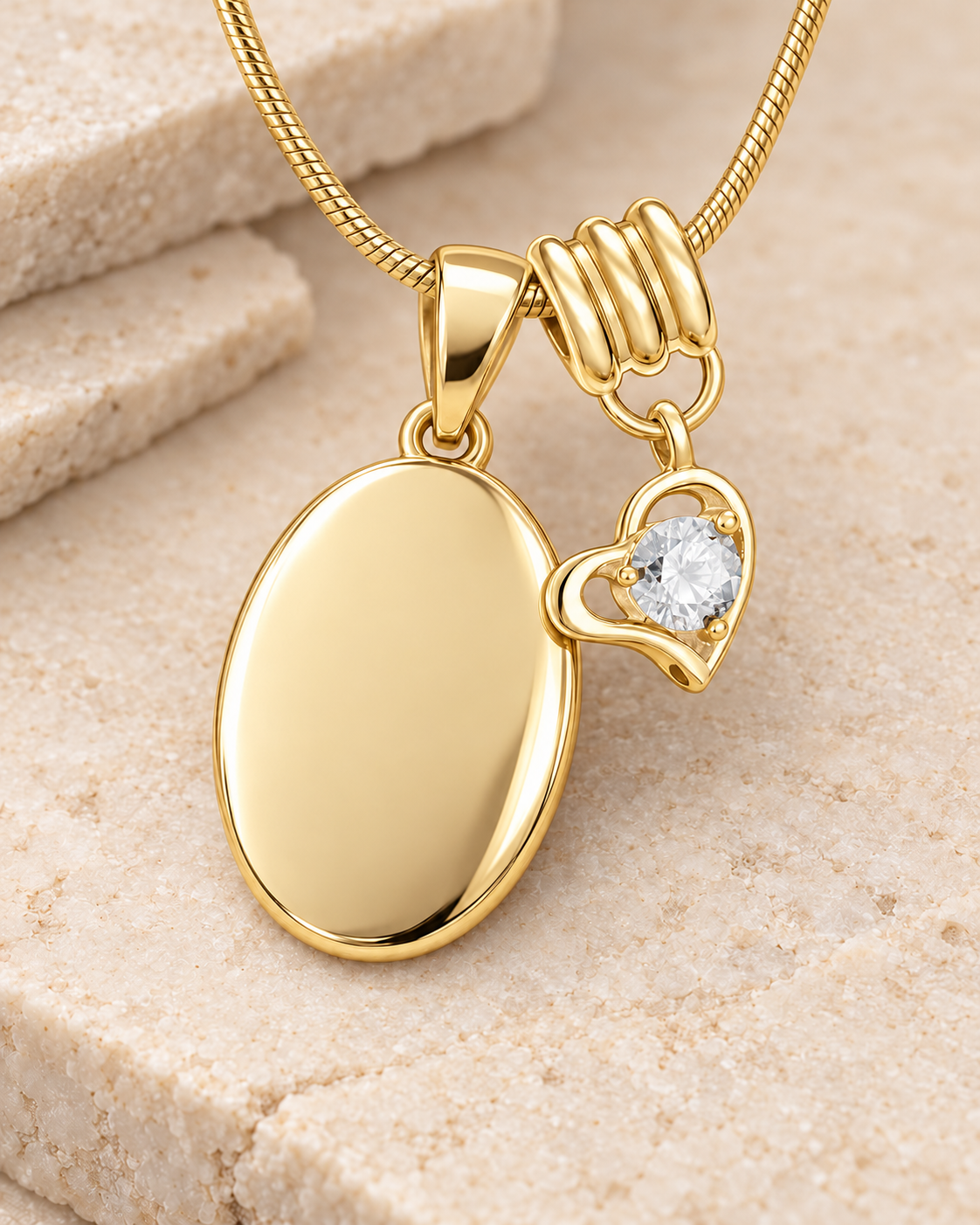 April gold birthstone heart hanger with an illustrative matching oval pendant; display pendant and chain sold separately.