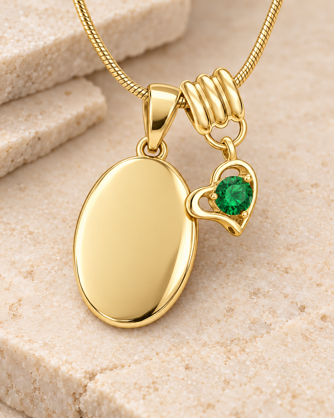 May gold birthstone heart hanger with an illustrative matching oval pendant; display pendant and chain sold separately.