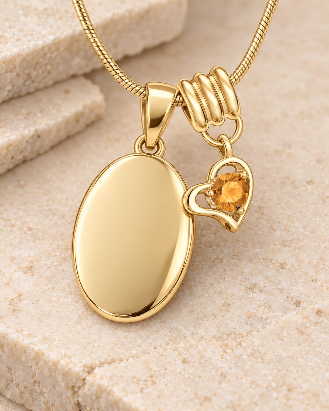 November gold birthstone heart hanger with an illustrative matching oval pendant; display pendant and chain sold separately.