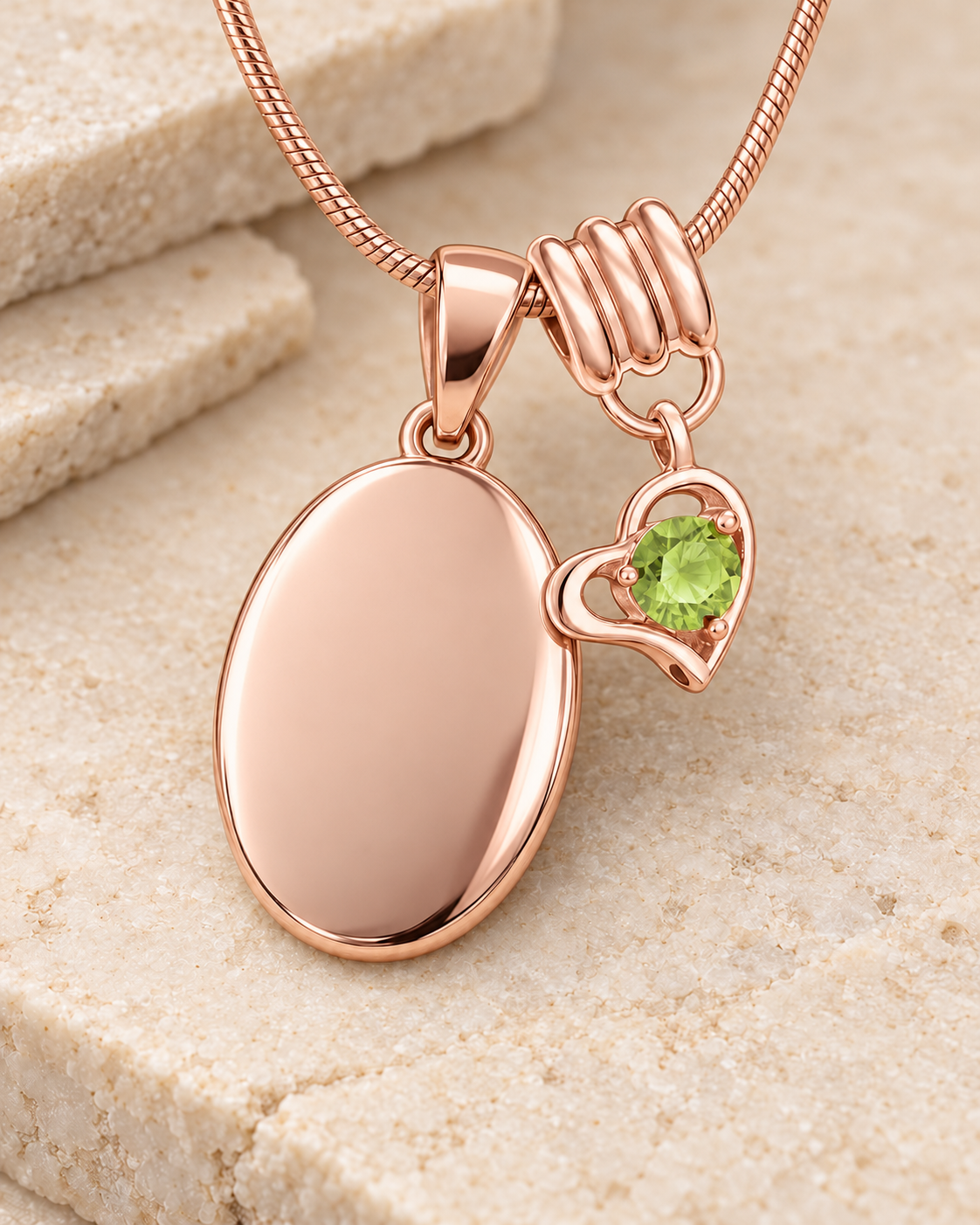 August rose gold birthstone heart hanger with an illustrative matching oval pendant; display pendant and chain sold separately.