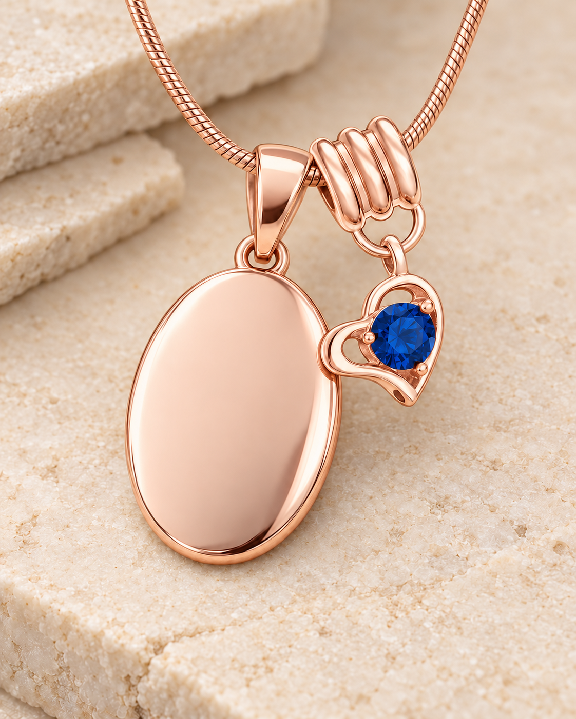 September rose gold birthstone heart hanger with an illustrative matching oval pendant; display pendant and chain sold separately.
