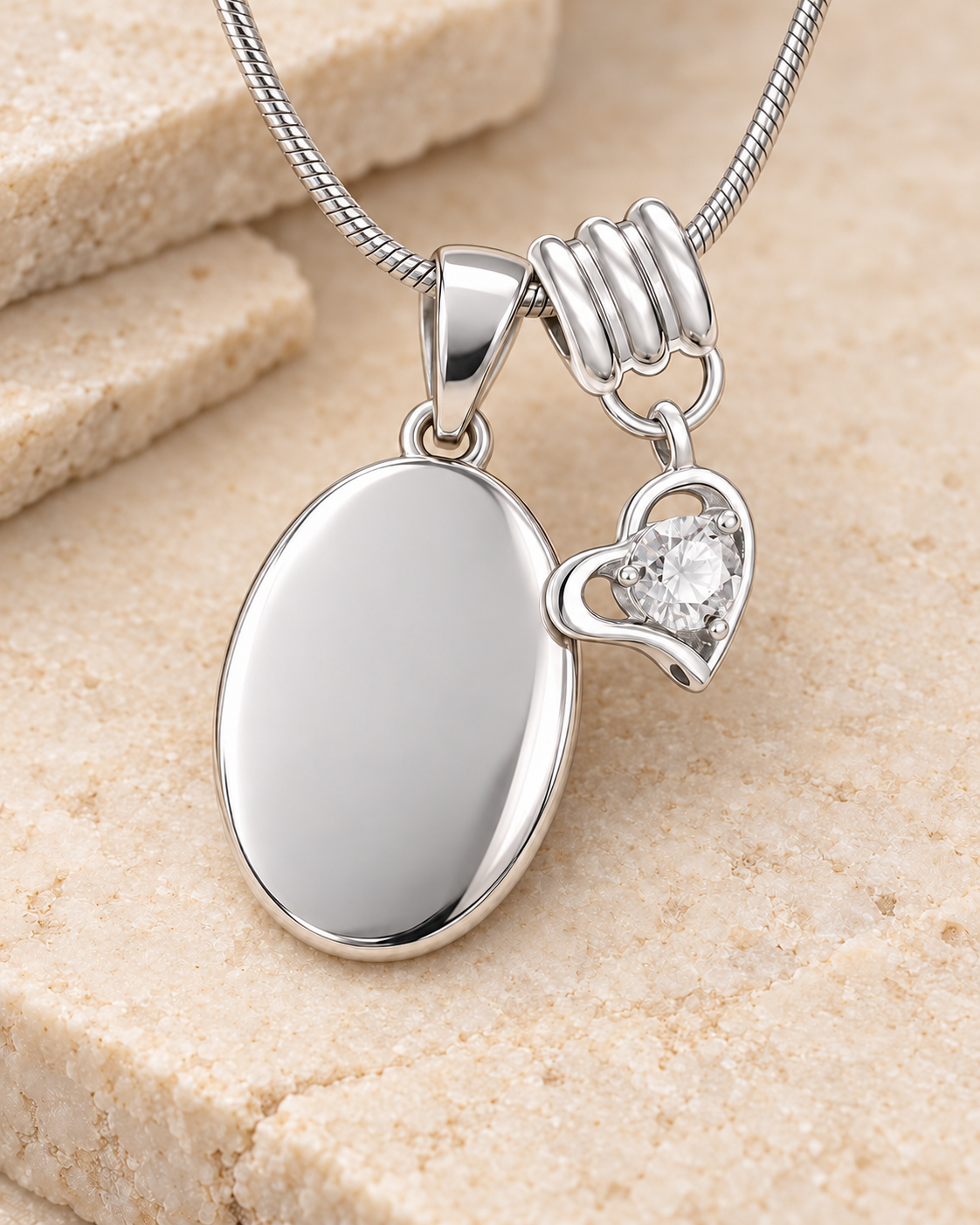 April silver birthstone heart hanger with an illustrative matching oval pendant; display pendant and chain sold separately.