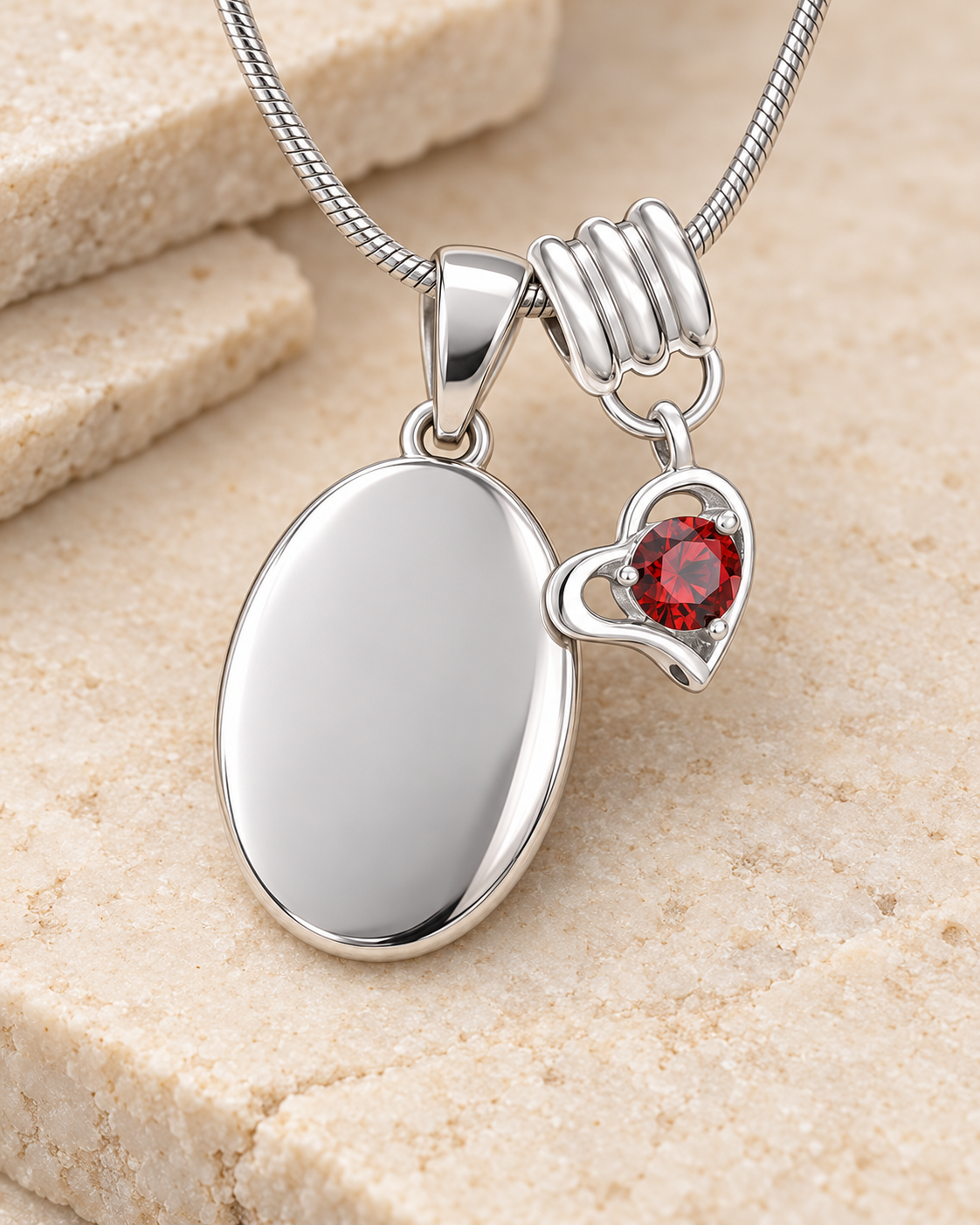 January silver birthstone heart hanger with an illustrative matching oval pendant; display pendant and chain sold separately.