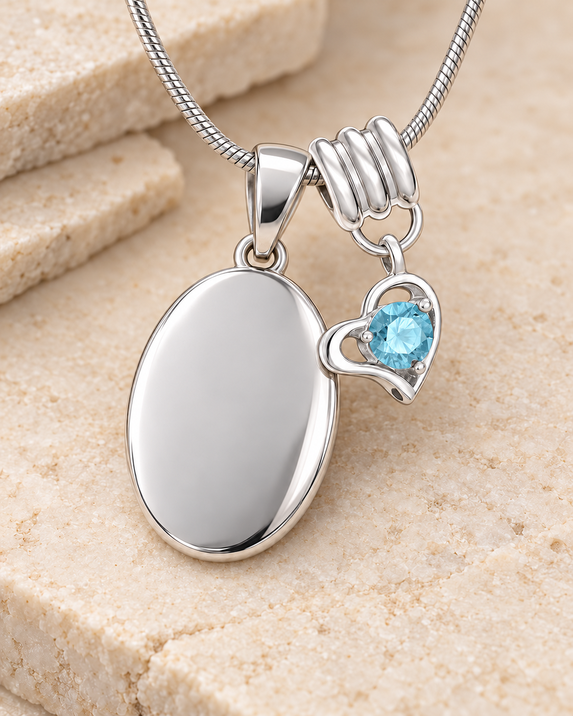 March silver birthstone heart hanger with an illustrative matching oval pendant; display pendant and chain sold separately.