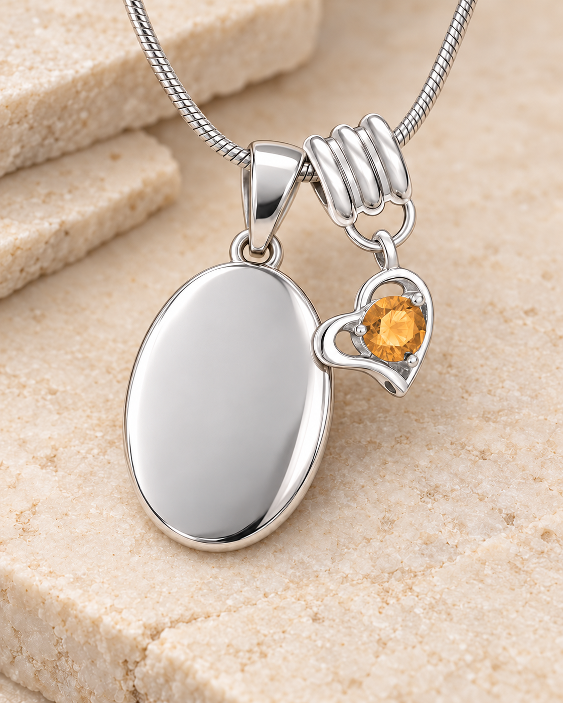 November silver birthstone heart hanger with an illustrative matching oval pendant; display pendant and chain sold separately.
